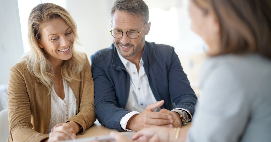 Couple in a meeting with a professional woman