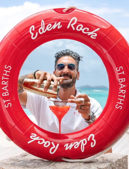 A man pours a cocktail at Eden rock in St Barts, Caribbean