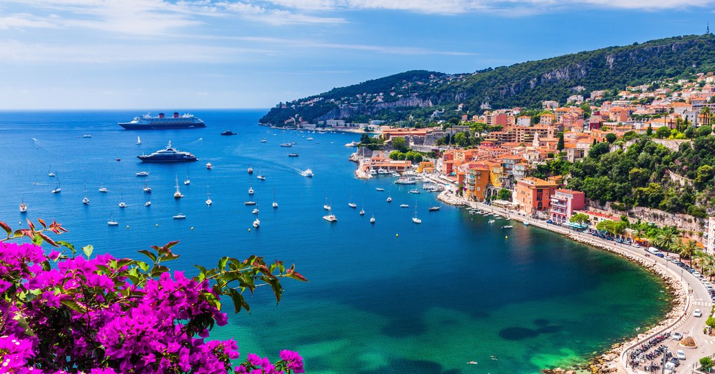 French Riviera coastline with blue sea and small yachts