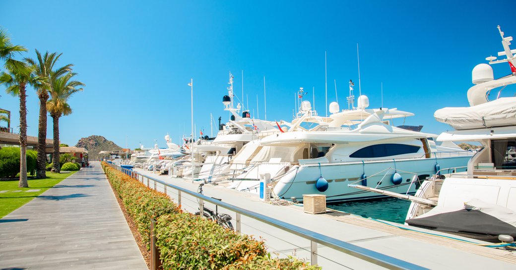 Motor yachts lined up in a marina in Turkey